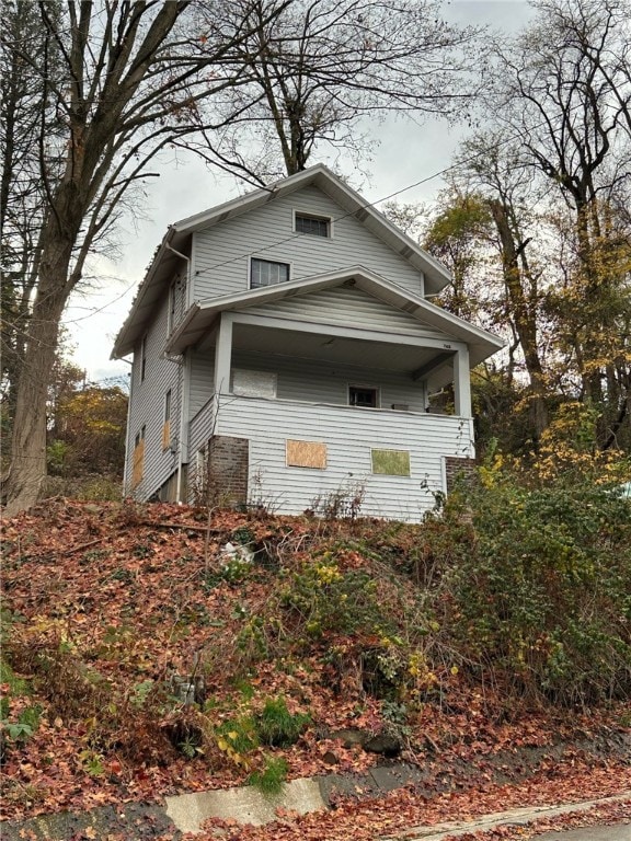 view of side of property with a balcony