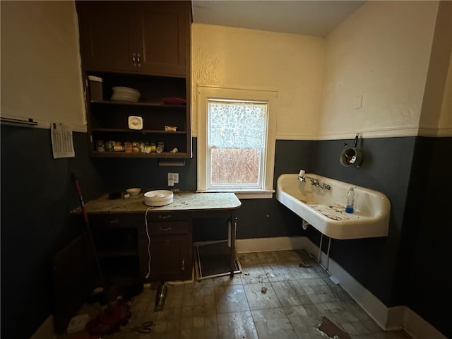 bathroom featuring tile floors and sink