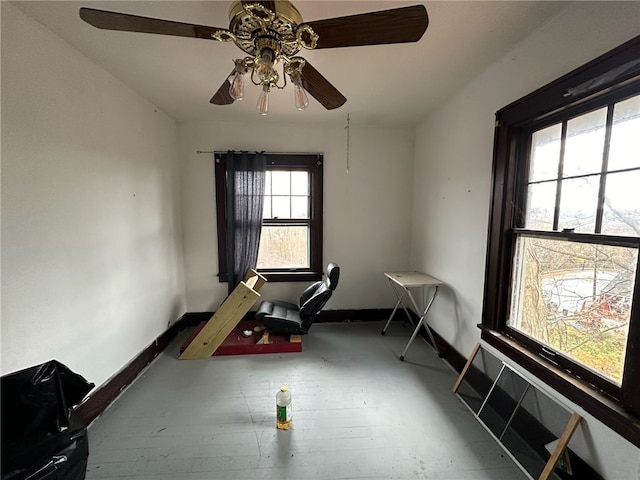 recreation room with dark wood-type flooring and ceiling fan