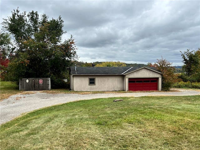 view of front of home with a garage and a front yard