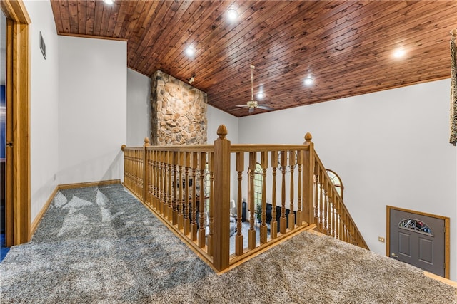 hallway featuring wood ceiling and carpet flooring