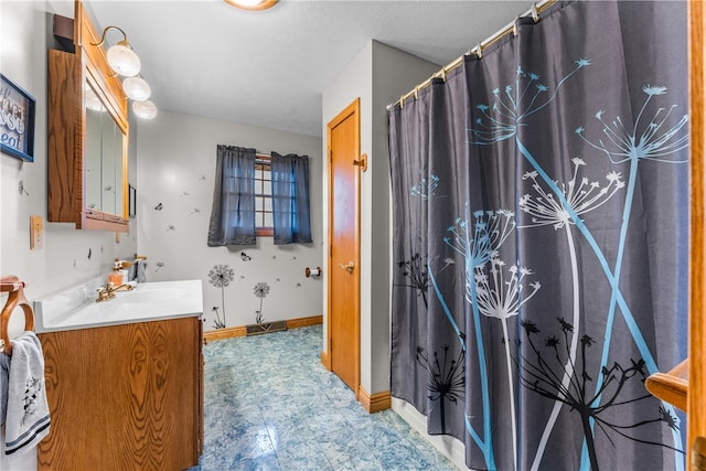 bathroom featuring vanity and tile floors