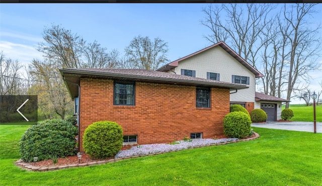 view of property exterior with a yard and a garage