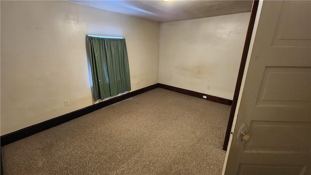 empty room featuring carpet