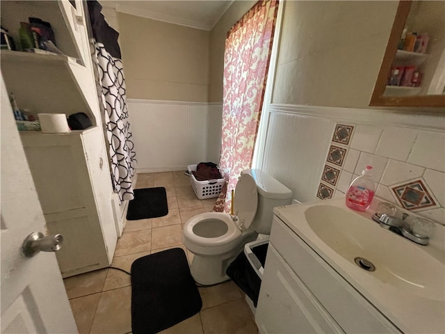 bathroom featuring walk in shower, vanity, toilet, and tile patterned floors