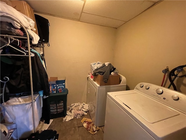 laundry room featuring separate washer and dryer and tile patterned flooring