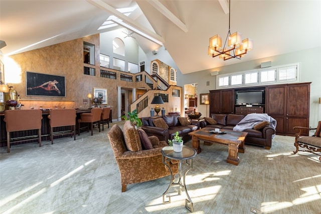 living room featuring a notable chandelier, beam ceiling, and high vaulted ceiling