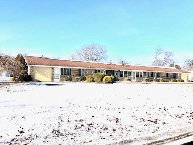 view of snow covered house