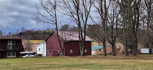 exterior space with a lawn and a shed