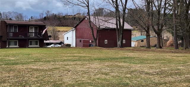 view of yard with a balcony