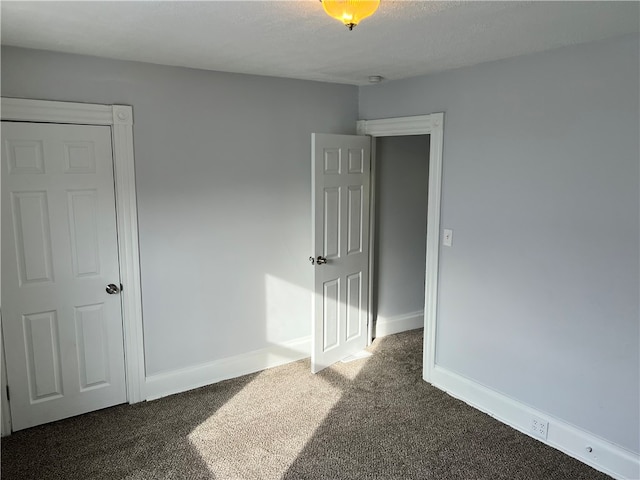 unfurnished bedroom with carpet floors