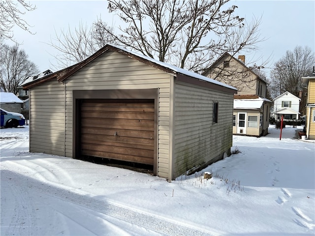 view of snow covered garage