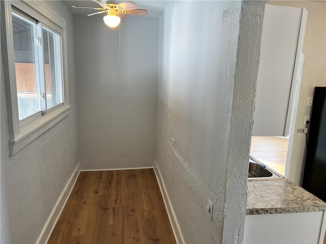 corridor featuring wood-type flooring