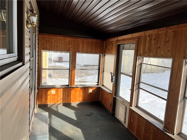 unfurnished sunroom with a wealth of natural light