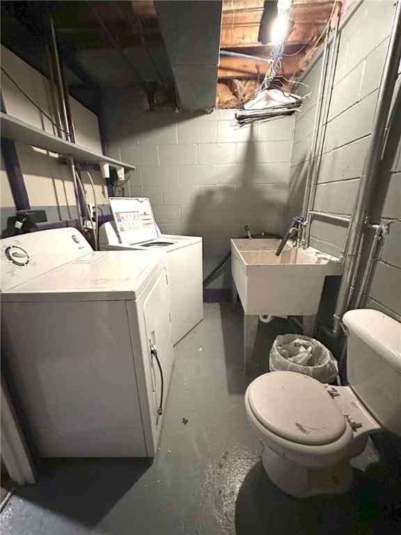 laundry room with washing machine and dryer and sink