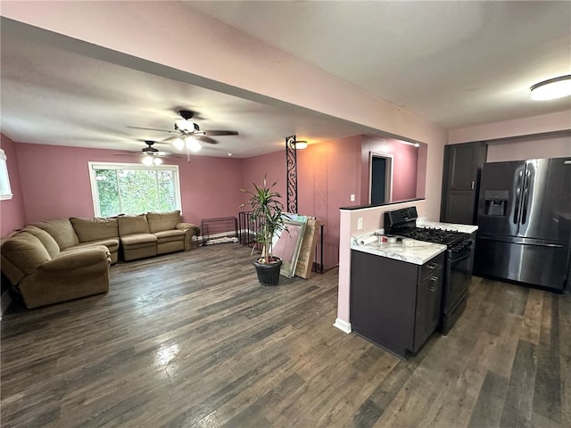 kitchen with ceiling fan, black range with gas cooktop, dark wood-type flooring, and stainless steel fridge with ice dispenser