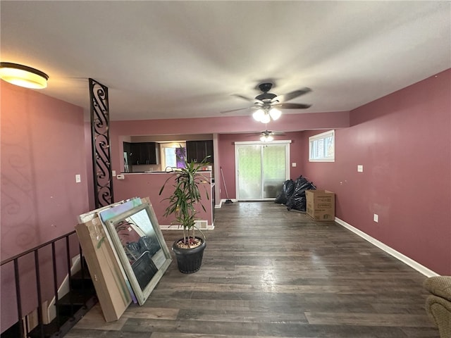 interior space featuring ceiling fan and dark hardwood / wood-style flooring