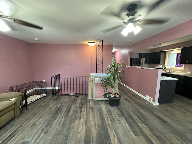 interior space featuring refrigerator, ceiling fan, sink, and dark hardwood / wood-style flooring