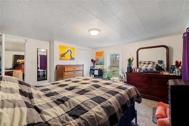 bedroom featuring light carpet