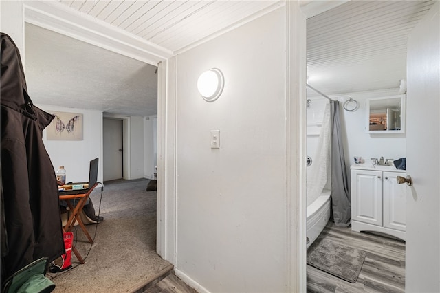 hallway with light hardwood / wood-style flooring