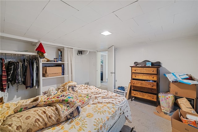 bedroom with carpet floors and a closet