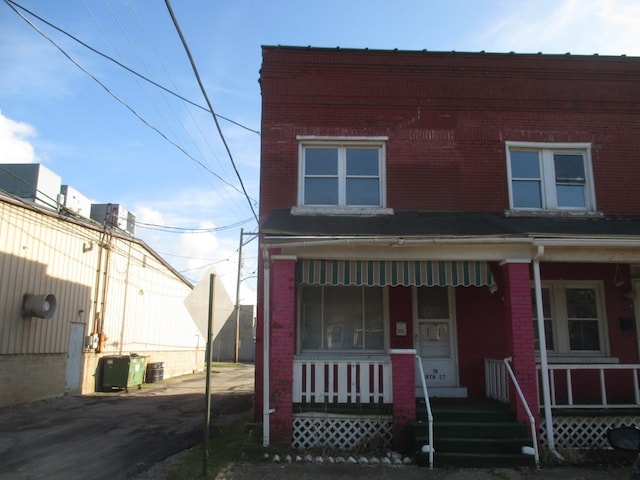 view of front of property with central AC unit and covered porch