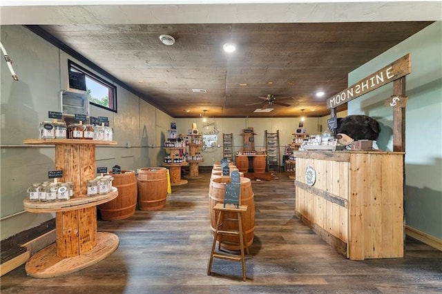 interior space with ceiling fan