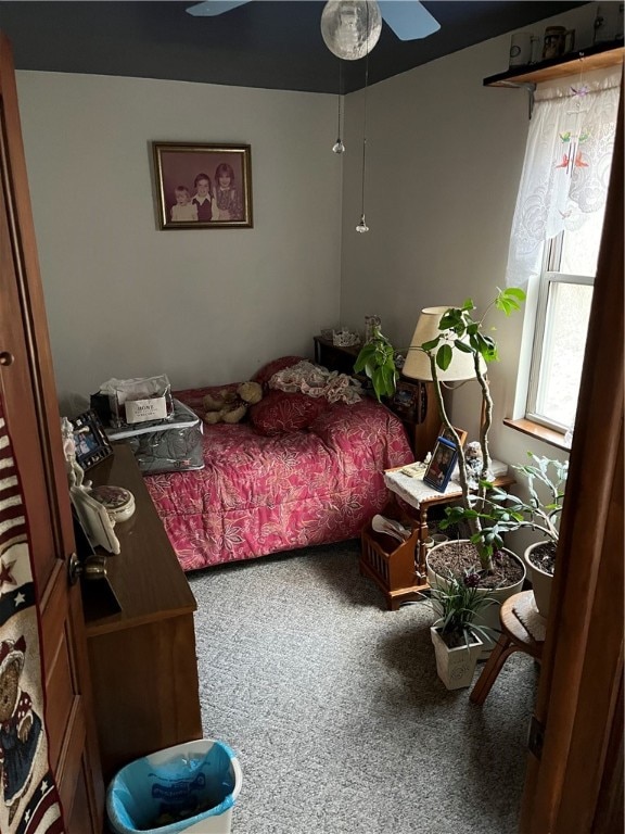 carpeted bedroom with ceiling fan