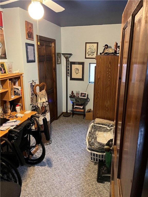 home office with carpet flooring and ceiling fan