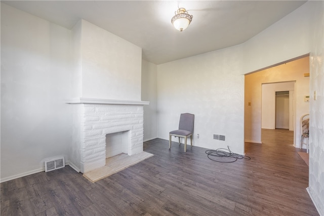 unfurnished living room featuring dark wood-type flooring