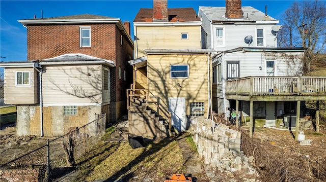 back of property featuring a wooden deck and central AC unit