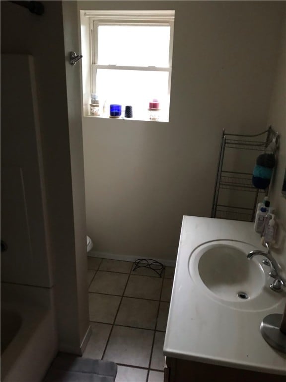 full bathroom featuring vanity, tile flooring, shower / tub combination, and toilet