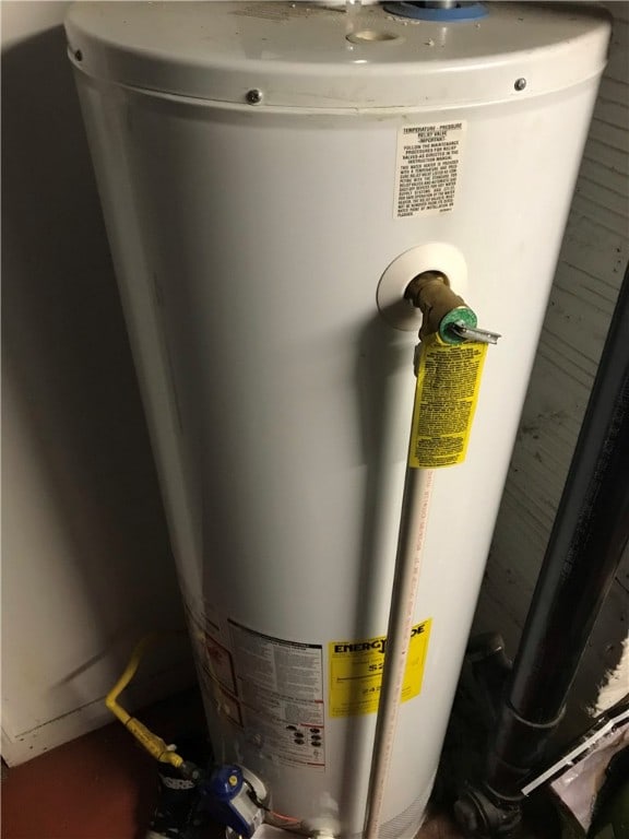 utility room featuring water heater