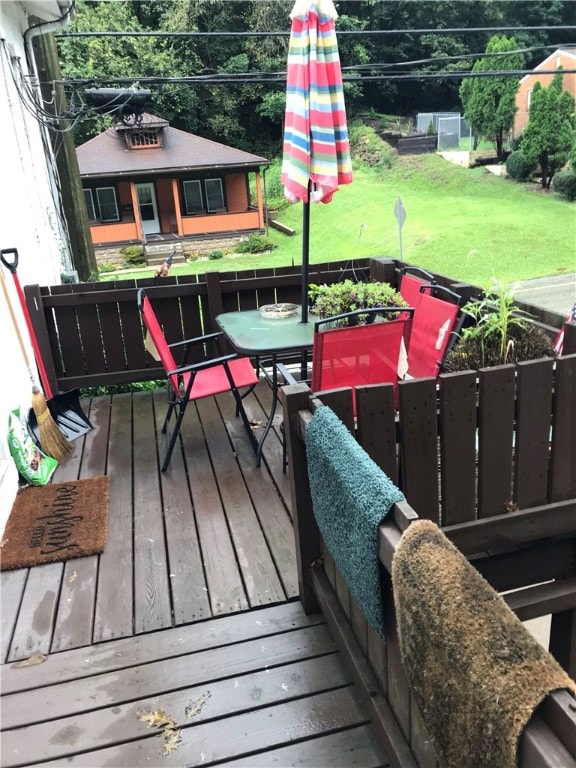 wooden balcony featuring a deck