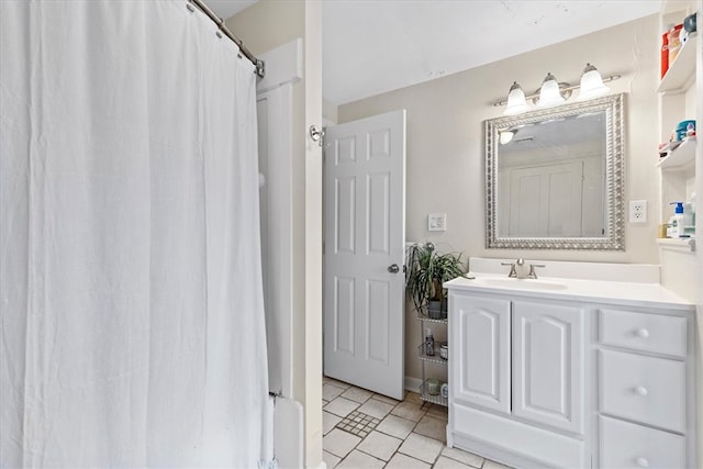 bathroom featuring tile flooring and large vanity