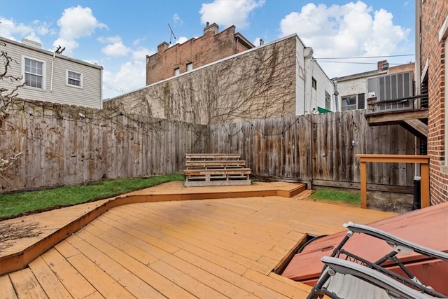 wooden deck with central air condition unit