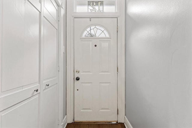 doorway featuring dark hardwood / wood-style floors