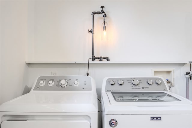 washroom with independent washer and dryer