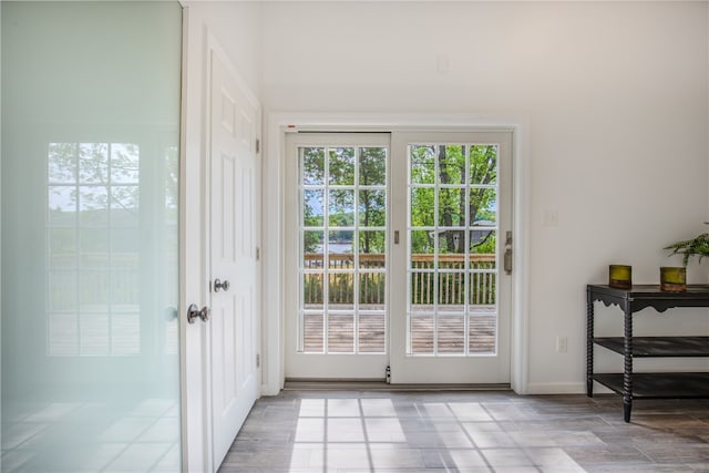 doorway with light tile patterned floors