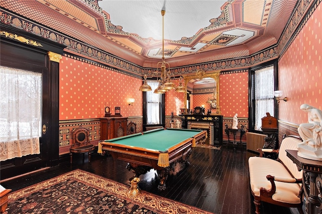 rec room featuring dark hardwood / wood-style flooring, a wealth of natural light, ornamental molding, and pool table