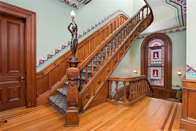 staircase with light hardwood / wood-style flooring