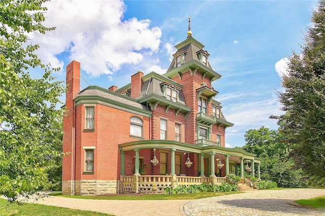 victorian house featuring covered porch