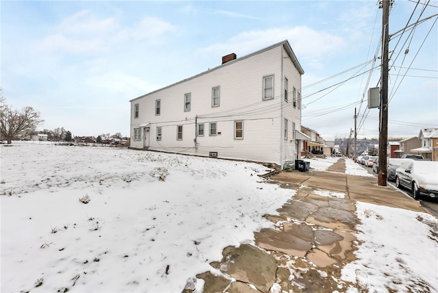 view of snow covered house