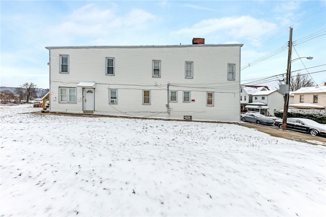 view of snow covered property