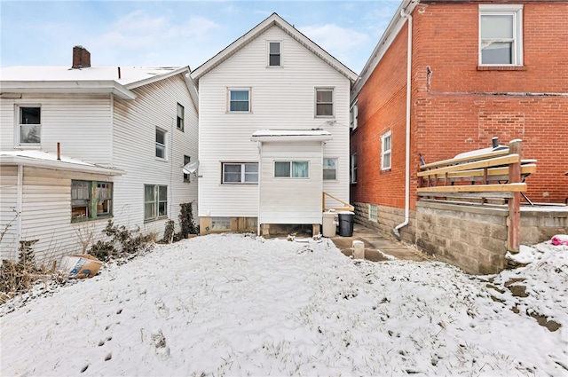 view of snow covered house