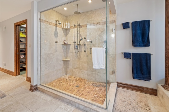 bathroom featuring walk in shower and tile patterned floors