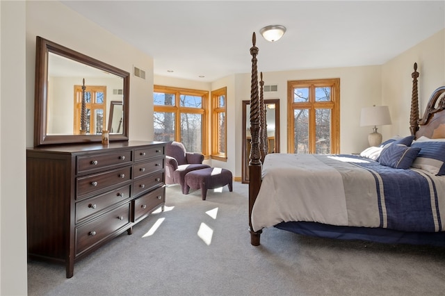 bedroom featuring light carpet