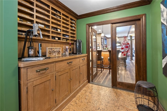 interior space featuring light hardwood / wood-style floors and ornamental molding