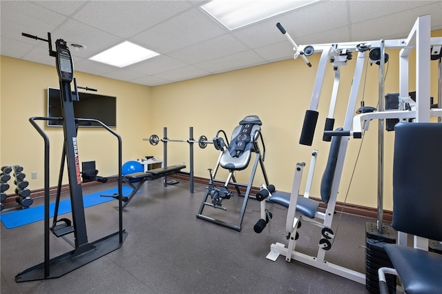 workout room featuring a paneled ceiling