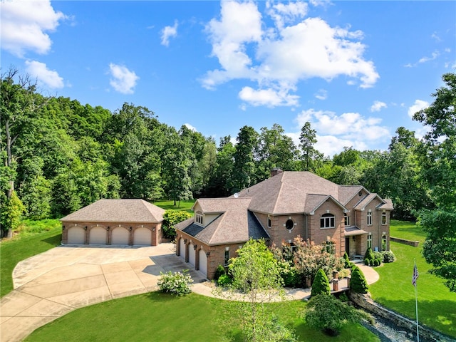 view of front of home featuring a garage and a front lawn